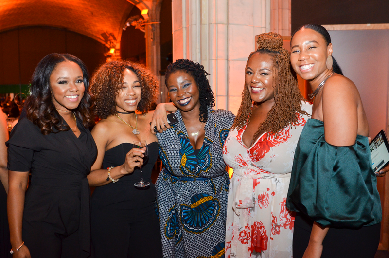 The Root staffer Danielle Young (second from right) and guestsDerrick Davis